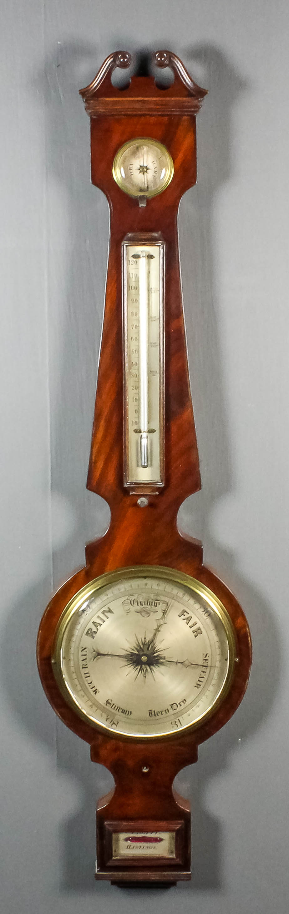 A 19th Century mahogany wheel barometer, thermometer and hydrometer by A. Boffi of Hastings, with