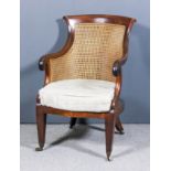 A 19th Century mahogany framed Bergere easy chair with curved crest rail and scroll arm terminals,