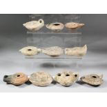 A collection of Greek, Roman and Islamic pottery oil lamps, including - circa 3rd Century Greek with