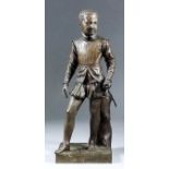 19th Century French school - Brown patinated bronze figure of a young man wearing doublet and