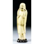 A Chinese carved ivory standing figure of Hotei, 10ins (25.4cm) high (19th century), on hardwood