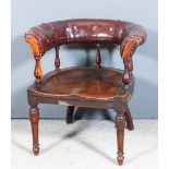 A late Victorian mahogany framed tub shaped library chair, the horseshoe shaped back upholstered