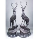 After Jules Moigniez (1835-1894) - A pair of modern brown patinated bronze figures of stags on rocky