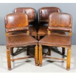 A set of four early 20th Century oak dining chairs of "17th Century" design, the seats and backs