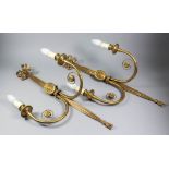 A pair of gilt brass two-branch wall lights of "Neo Classical" design, the moulded ribbon pattern