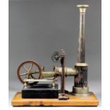An early 20th Century tin plate model of a stationary steam engine, "Noris" by E.P, on wooden