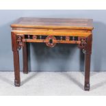 A Chinese hardwood rectangular side table with flush panelled top, frieze fretted and carved with