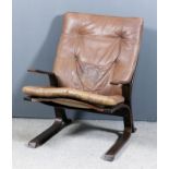 A 20th Century bent plywood and canvas lounge chair in the manner of Ingmar Relling, with loose