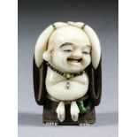 A Japanese carved ivory and wood netsuke of a standing Hotei, by Akishige, wearing a beaded necklace