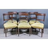 A set of six George III mahogany dining chairs, the rectangular carved panel crest rails inlaid with