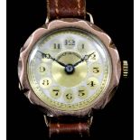 A 20th Century lady's 9ct gold cased manual wind wristwatch, the silvered and gold dial with