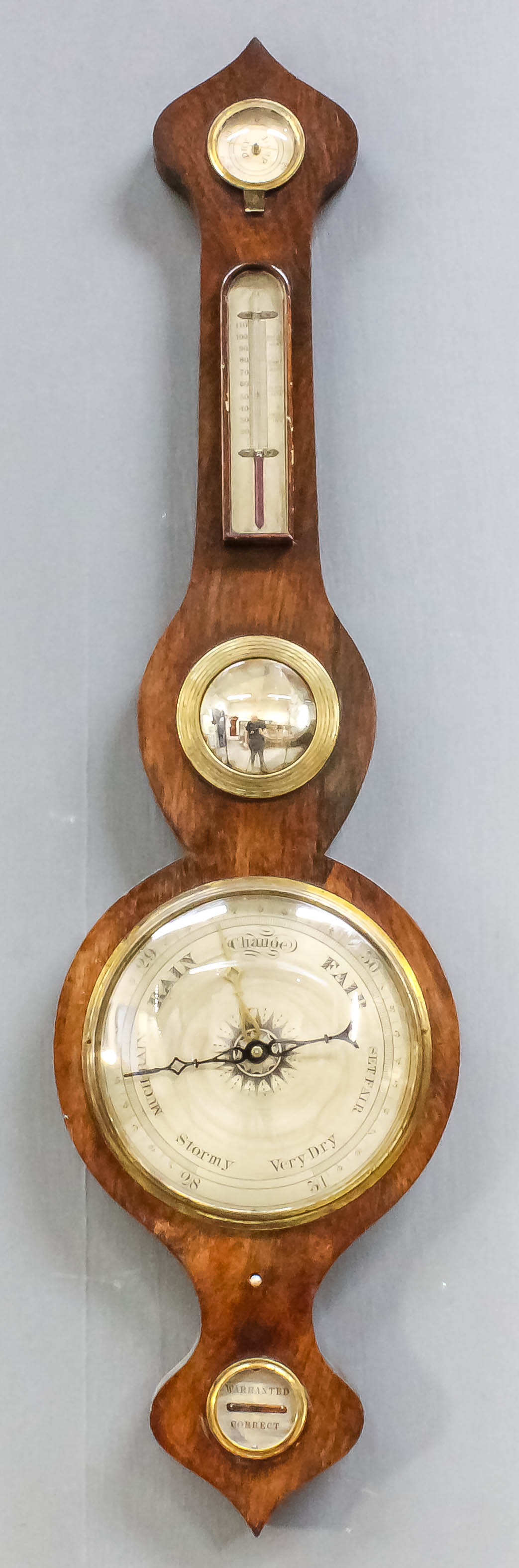 An early 19th Century rosewood wheel barometer, thermometer and hydrometer, with 8ins diameter