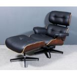 A modern walnut veneered plywood and metal framed easy chair "Eames Lounge (No. 670) and Ottoman (