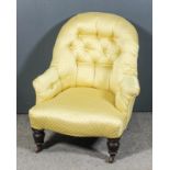 A Victorian spoon back easy chair with outscroll arms, upholstered in old gold cloth, the back