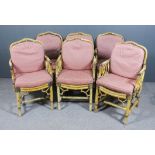 A set of six cane conservatory armchairs, the seats and backs with loose cushions upholstered in