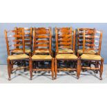 A harlequin set of eight early 19th Century ash ladder back chairs, each with five shaped rails to