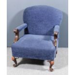 A 1920's low open arm easy chair, upholstered in blue corded moquette and with scroll arm terminals,