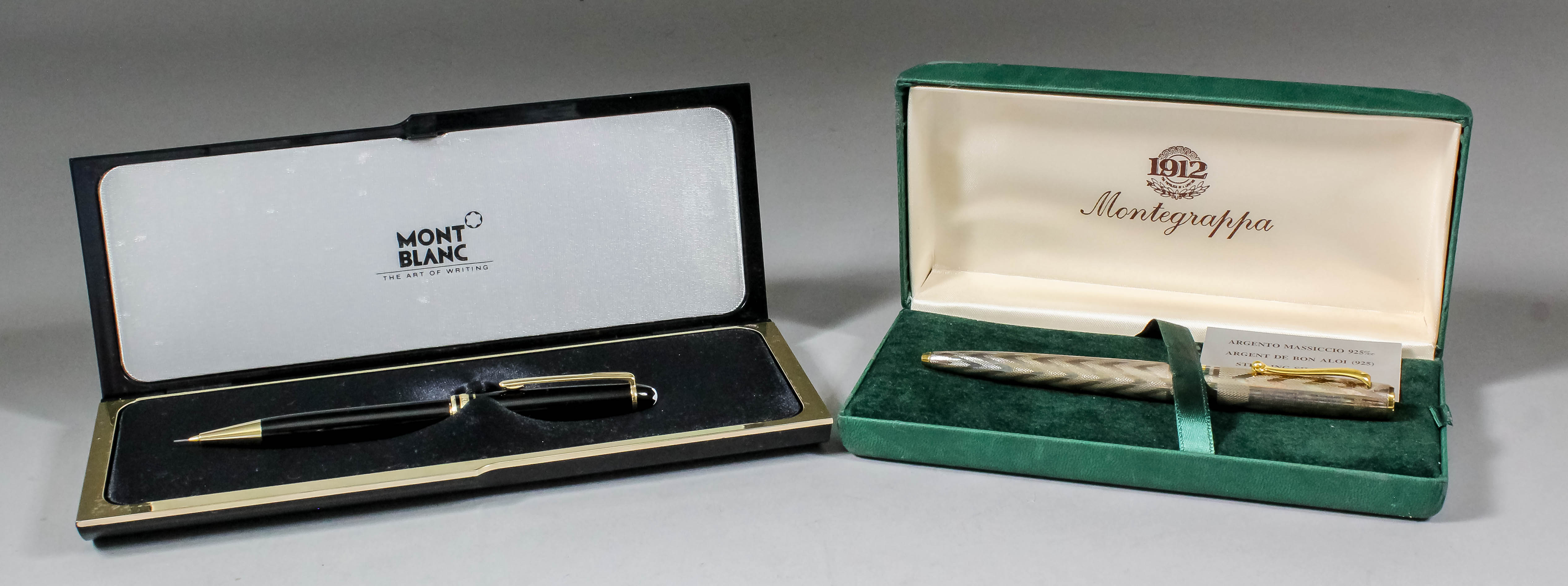 A modern Montblanc pencil in fitted case, and a Montegrappa silvered case biro with engine turned