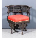 A 19th Century hardwood corner chair of "Moorish" design, crest rail inlaid with mother of pearl, on