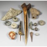 A small collection of antiquities, including two clay spindle whorls, both 1.5ins diameter, a