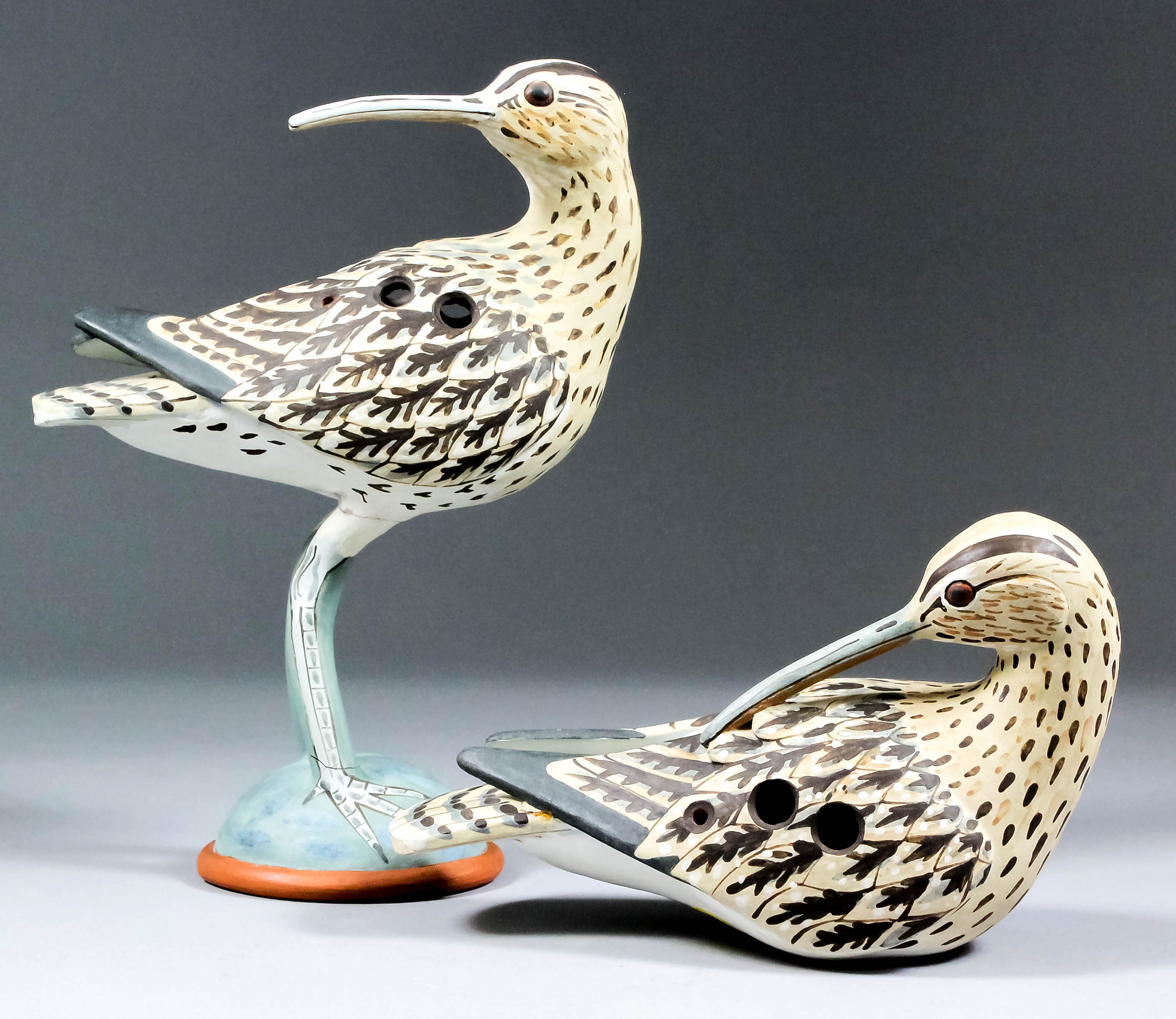 Neil Irons (born 1949) - Two ceramic ocarina - Standing "Whimbrel", 8.25ins high, and resting "