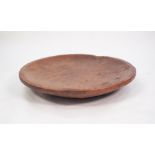 NATURALISTIC LARGE WOODEN FOOD BOWL, having flat rim, good patination, 28 1/2" (72.5cm) diameter