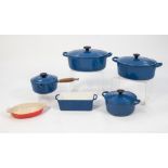 FOUR PIECES OF LE CREUSET BLUE ENAMELLED COOK WARE, comprising: GRADUATED PAIR OF OVAL TWO HANDLED