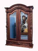 A LATE NINETEENTH/EARLY TWENTIETH CENTURY FRENCH WALNUTWOOD WARDROBE, enclosed with a pair of shaped