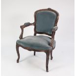 A TWENTIETH CENTURY FRENCH BEECHWOOD OPEN ARM FAUTEUIE, covered in blue velour