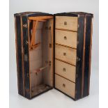 AN EARLY 1900's METAL BOUND, WOODEN RIBBED AND BLACK LEATHERETTE COVERED DELUXE CABIN TRUNK, the