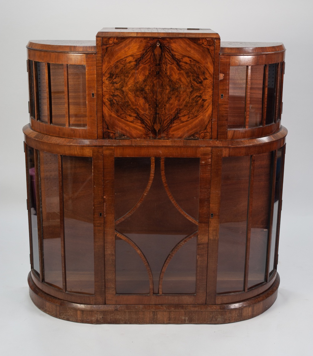 a 1930's WALNUT WRITING AND DISPLAY CABINET, centred with a fall front writing compartment above a