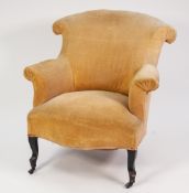 AN EDWARDIAN YELLOW VELOUR COVERED ARMCHAIR, on Japanned cabriole forelegs