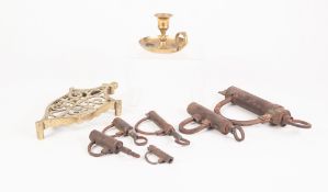 SIX BYGONE FRENCH CAST METAL PADLOCKS, together with a PIERCED BRASS TRIVET and a CHAMBERSTICK, (8)