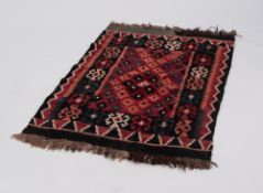CAUCASIAN TRIBAL KELIM SMALL BORDERED RUG, with an all-over diaper pattern in orange and black on