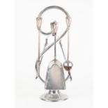 STYLISH FRENCH CHROME PLATED FIRESIDE COMPANION, modelled as a large 'S' on a circular base, housing