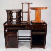 A STAINED BEECHWOOD KNEEHOLE WRITING DESK, TOGETHER WITH A NEST OF THREE OAK TABLES, an oak circular