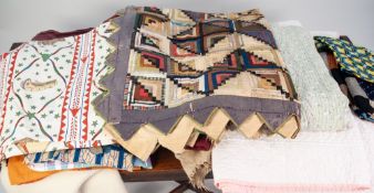 VINTAGE SILK QUILT, hand worked in colours with design of squares within a zig-zag border, 60" x 48"