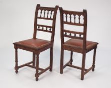 A SET OF SIX EARLY 1900's OAK SINGLE DINING CHAIRS, with spindle filled rail racks, leatherette