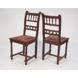 A SET OF SIX EARLY 1900's OAK SINGLE DINING CHAIRS, with spindle filled rail racks, leatherette