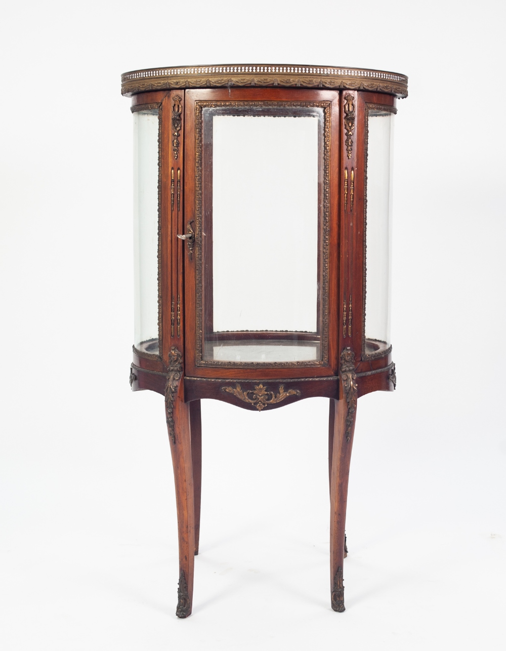 LATE NINETEENTH CENTURY MAHOGANY AND GILT METAL MOUNTED SMALL OVAL VITRINE, the top inset with an