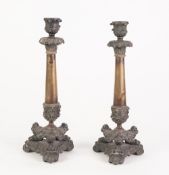 PAIR OF FRENCH PATINATED AND GILT METAL CANDLESTICKS, each of tapering form with urn shaped