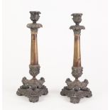 PAIR OF FRENCH PATINATED AND GILT METAL CANDLESTICKS, each of tapering form with urn shaped