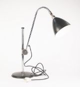 CHROME PLATED FRENCH ADJUSTABLE DESK OR TABLE LAMP, with black Jappanned shade and circular base,