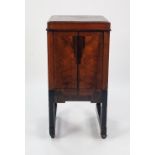 A 1930's 'ACME' PRODUCT WALNUT, MACASSAR EBONY AND PARCEL EBONISED CABINET, with lift up top