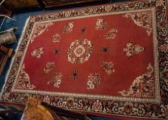 MACHINE MADE EASTERN CARPET, with floral centre medallion, scattered floral sprays and floral