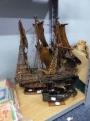 SCRATCH BUILT WOOD AND MANUFACTURED BOARD MODEL OF A MAN-O-WAR, with painted paper sails, on