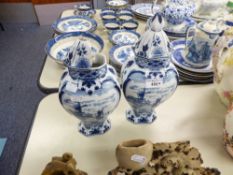 PAIR OF DUTCH DELFT BLUE AND WHITE VASES AND COVERS, DEOCRATED TO THE FRONT WITH CANAL SCENE, 12 1/