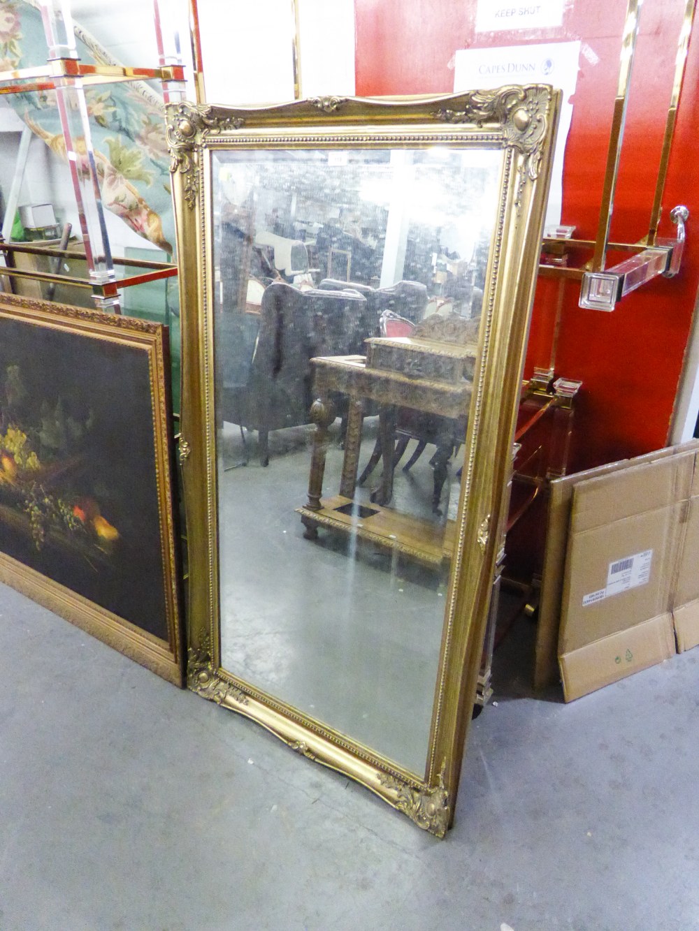 A MODERN GILT FRAMED RECTANGULAR WALL MIRROR, BEAD EDGE AND HAVING CORNER DETAIL WITH BEVEL GLASS