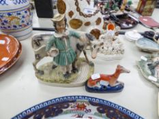 AN EARLY NINETEENTH CENTURY STAFFORDSHIRE POTTERY WELL MODELLED GROUP OF A MILK MAID AND A COW, ON