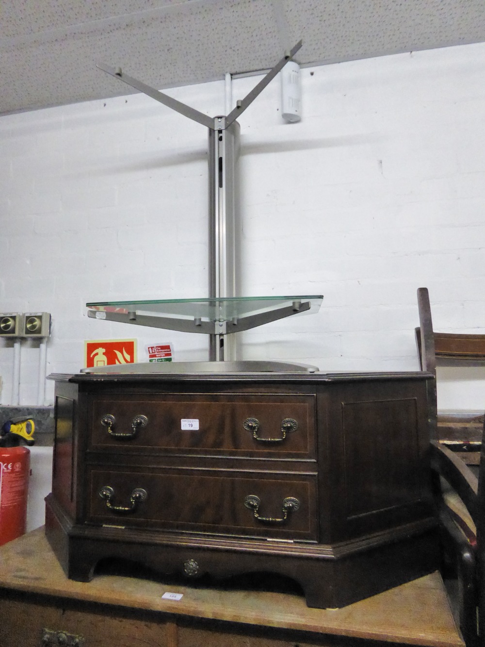 A MAHOGANY CORNER TELEVISION STAND WITH FALL FRONT, AND A GREY CANTILEVER STAND WITH TWO PLATE GLASS